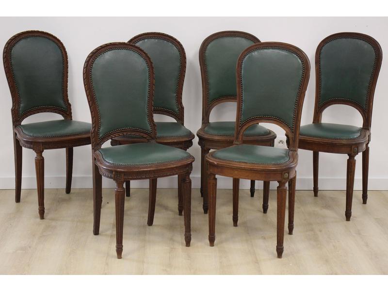 SUITE DE SIX CHAISES en hêtre teinté gainées...