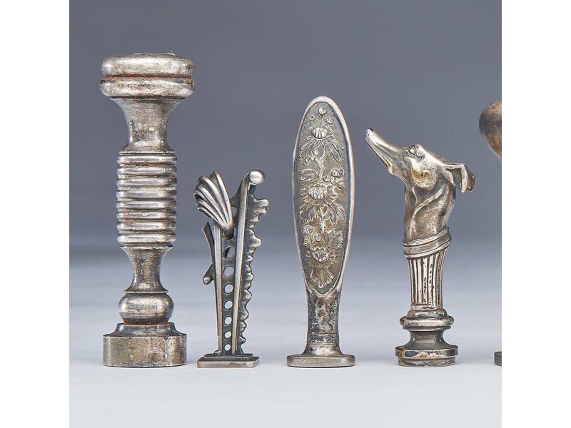QUATRE CACHETS en argent et bronze argenté,...