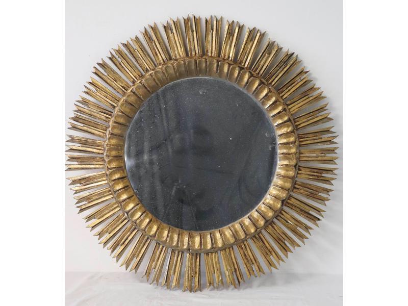 MIROIR circulaire dans un cadre rayonnant...