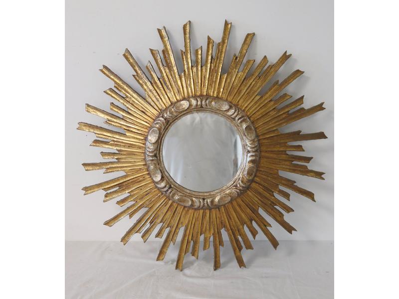 MIROIR circulaire dans un cadre en bois doré...