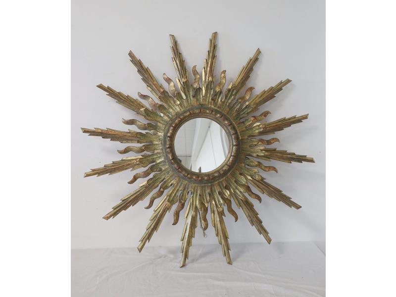 MIROIR circulaire dans un cadre en bois doré...