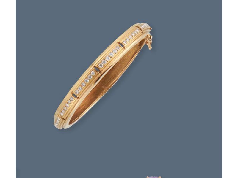 PETIT BRACELET articulé en or jaune (750)...
