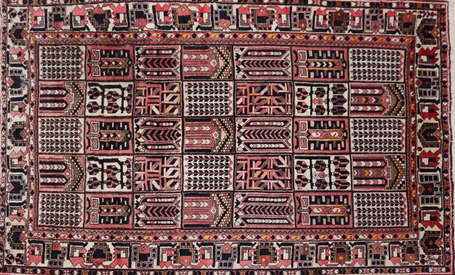 TAPIS en laine polychrome dans les tons roses,...