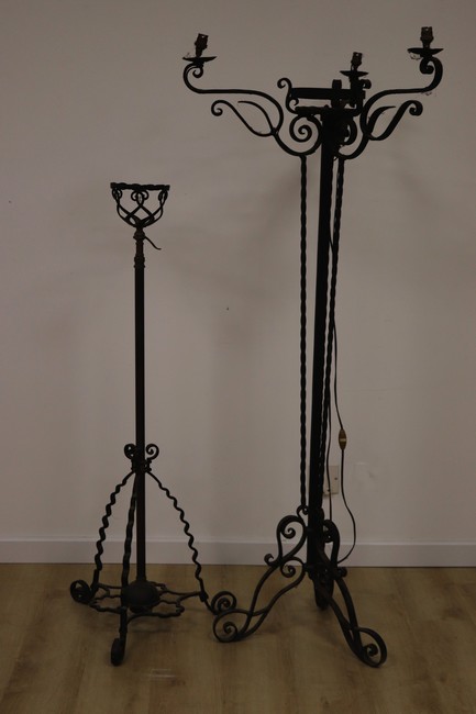 DEUX PORTE-CIERGES en fer forgé, l'un à trois...