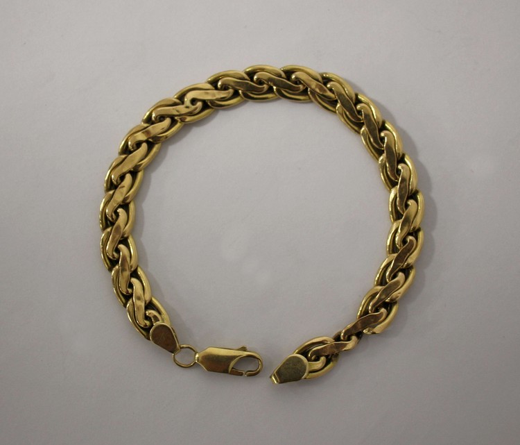 BRACELET souple en or jaune (750) tressé...