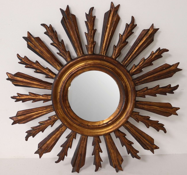 MIROIR circulaire dans un cadre en bois doré...