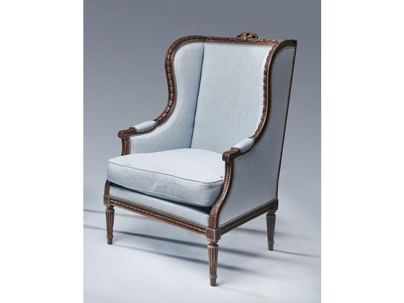 BERGERE à oreilles, en hêtre mouluré sculpté...