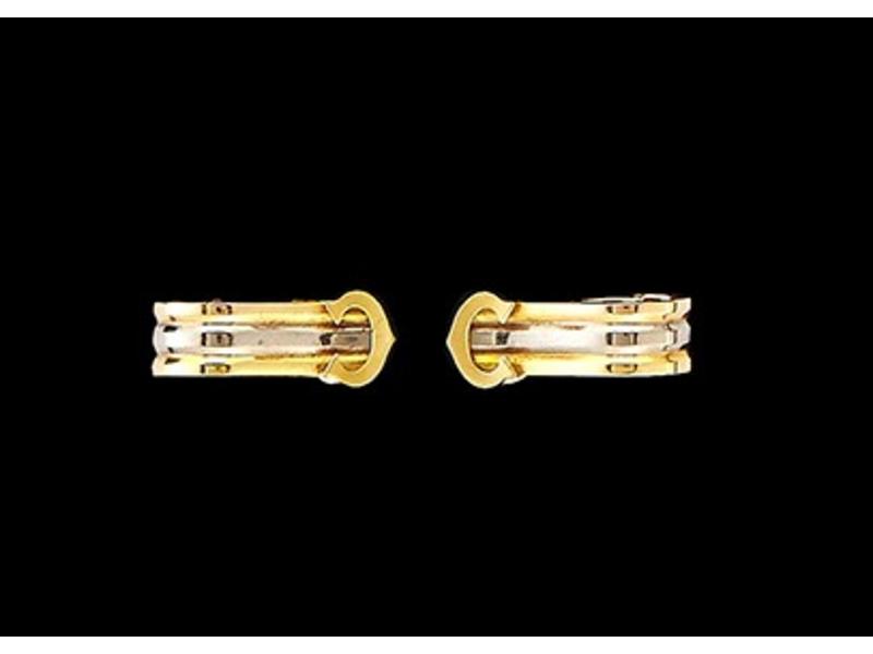 CARTIER : BOUCLE D'OREILLES trois ors, orné...