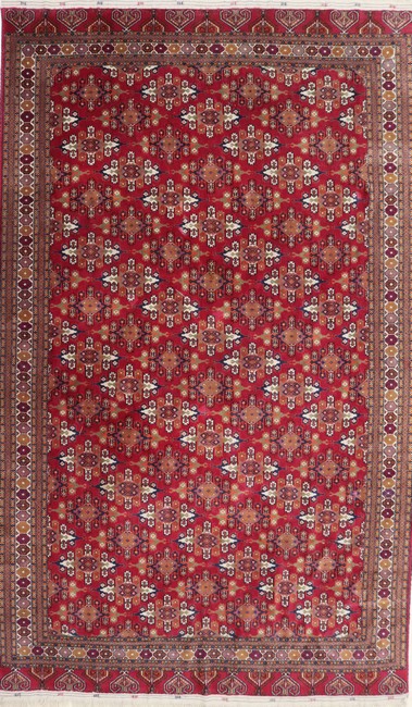 TAPIS en laine polychrome à décor de médaillon...
