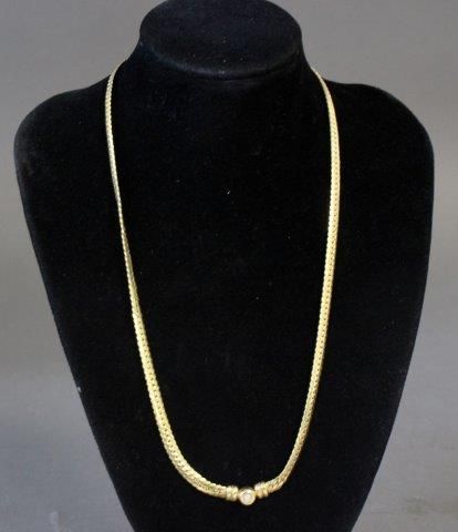 COLLIER en or jaune (750) à mailles plates...
