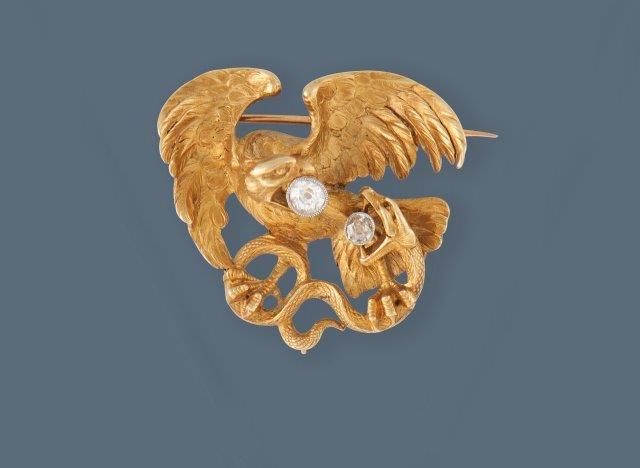 BROCHE "Chimère au serpent" en or (750) et...