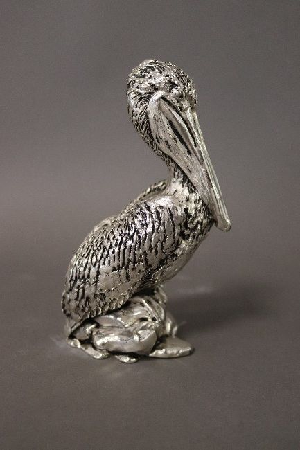 FIGURINE en argent (950) en forme de pél...