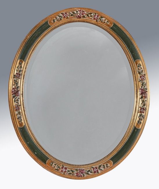 MIROIR de forme médaillon en bois mouluré,...