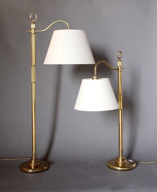 DEUX LISEUSES en métal doré à une lumière...