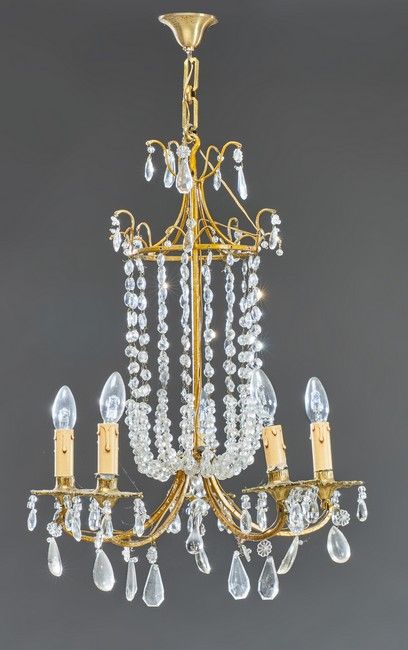 LUSTRE en bronze doré à cinq lumières, la...