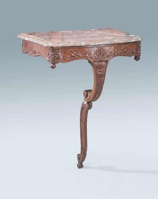 CONSOLE en chêne mouluré et sculpté de feuilles...