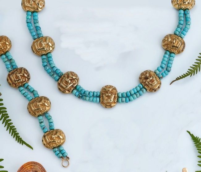 PARURE DE COLLIER ET BRACELET formés de sept...