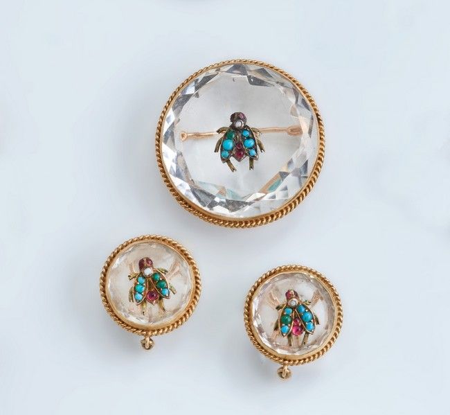 PARURE en or jaune (750) comprenant broche...