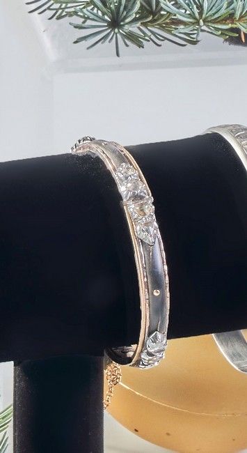 BRACELET rigide articulé en or jaune (750...