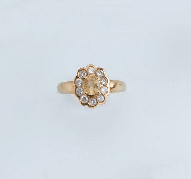 BAGUE FLEURS en or (750) sertie d'un saphir...