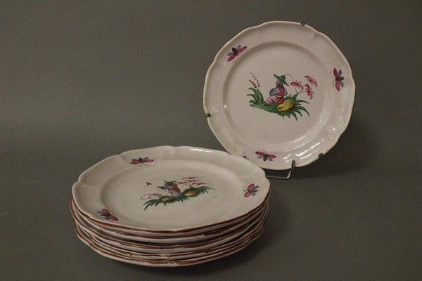 SIX ASSIETTES à bord chantourné en faïence...