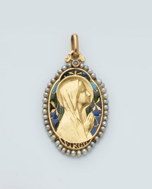 MÉDAILLE en or (750) figurant une Vierge...