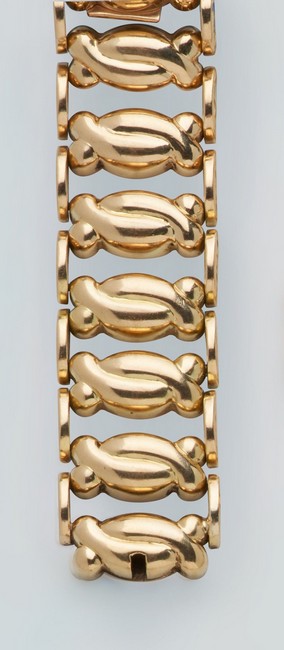 BRACELET en or jaune (750) à maillons articulés...