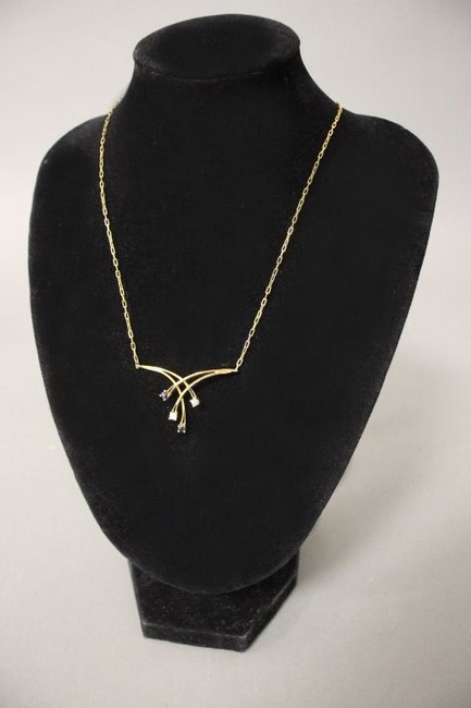 COLLIER en or jaune (750) comprenant une...