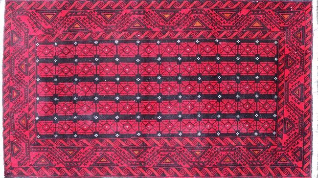 TAPIS en laine à décor de rectangles rouges...