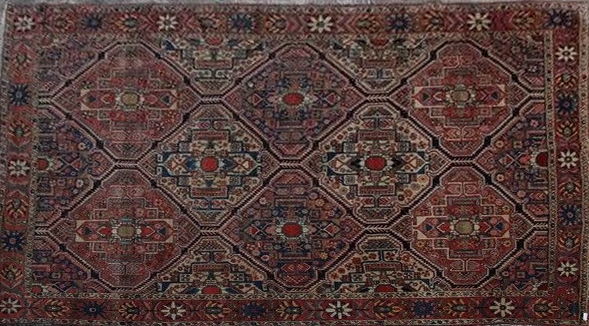 TAPIS en laine polychrome à décor de losanges...