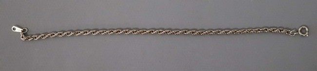 BRACELET à maillons tournés en métal arg...