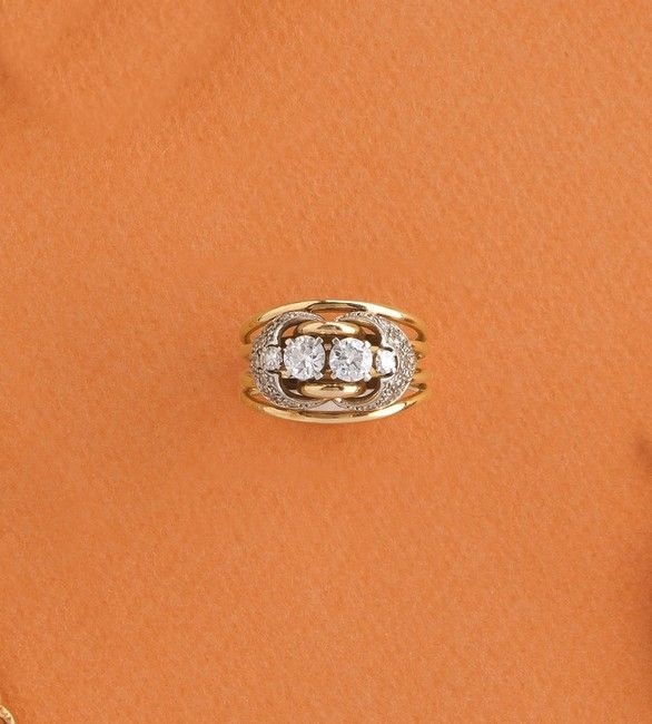 BAGUE en or rose (750) formée de quatre fins...