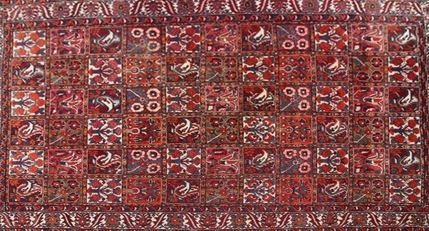 TAPIS en laine polychrome à décor de jardins...