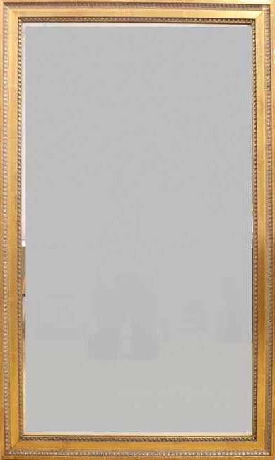 MIROIR rectangulaire en bois doré et sculpté...