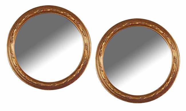 PAIRE DE PETITS MIROIRS RONDS à cadre en...