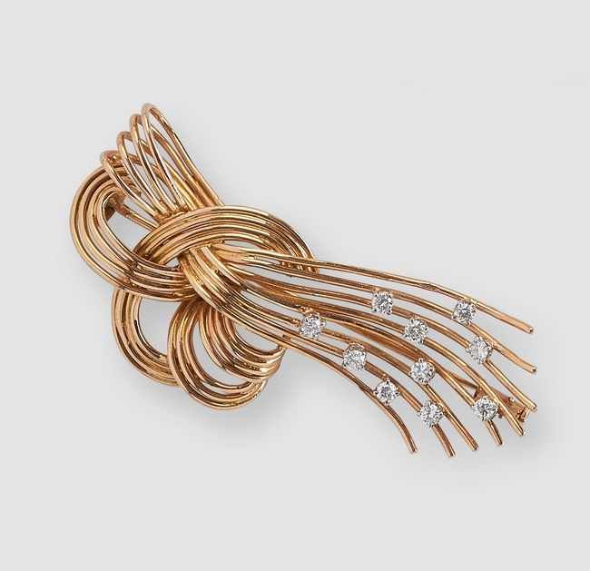BROCHE en or jaune (750) formant un nœud...