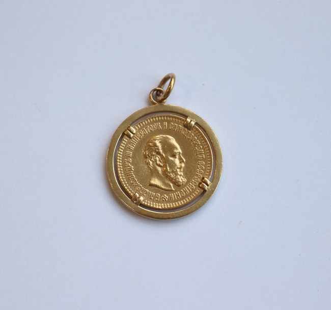 PENDENTIF en or (750) retenant une pièce...