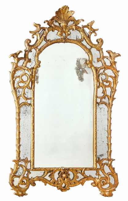 MIROIR à parecloses de forme chantournée...