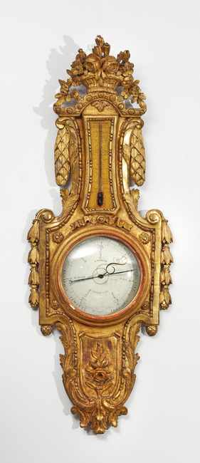 BAROMETRE-THERMOMETRE en bois sculpté et...