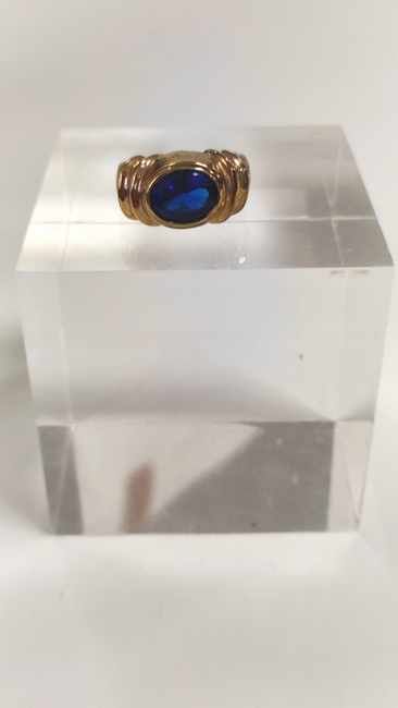BAGUE en métal doré et verre bleue.