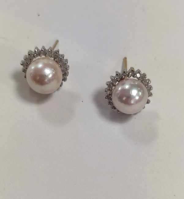 PAIRE DE BOUTONS D’OREILLES en or jaune (750)...