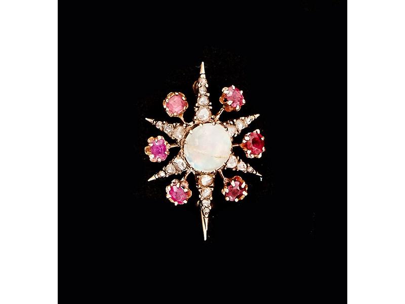 BROCHE étoile en or jaune et argent ornée...