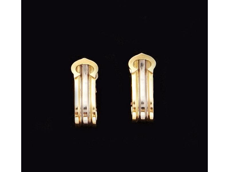CARTIER : BOUCLE D'OREILLES trois ors, orné...