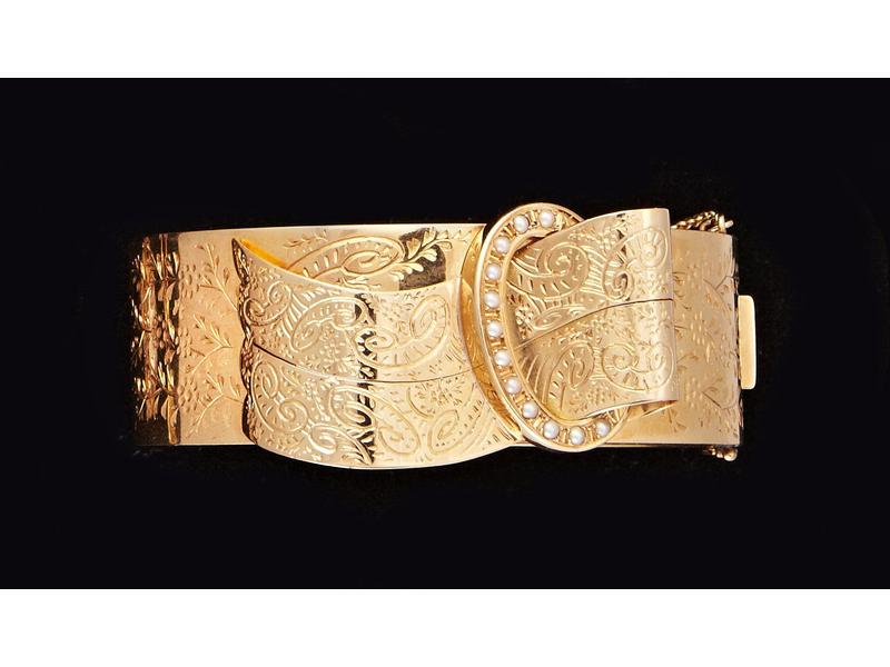 BRACELET rigide articulé en or jaune, formant...