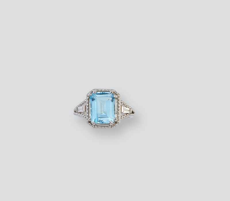 BAGUE en argent (925) ornée d'une topaze...