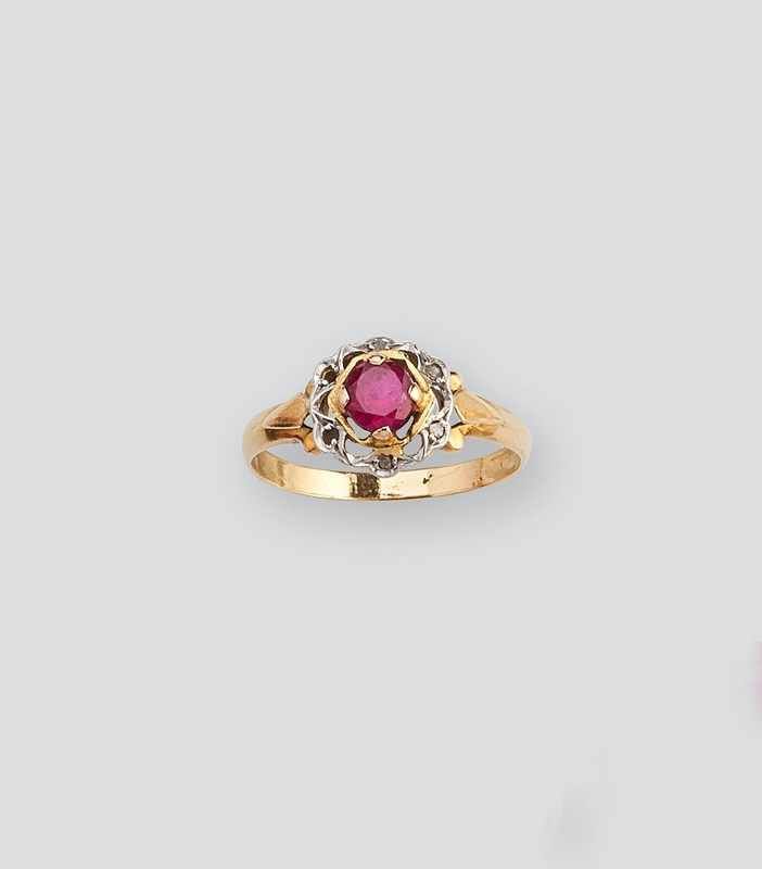 BAGUE en or (750) avec rubis synthétique...