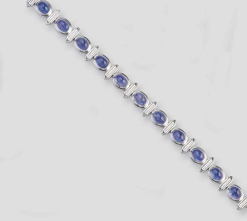 BRACELET en argent (925) serti de onze tanzanites...