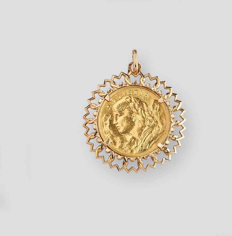 PENDENTIF en or (750) sertissant une pièce...