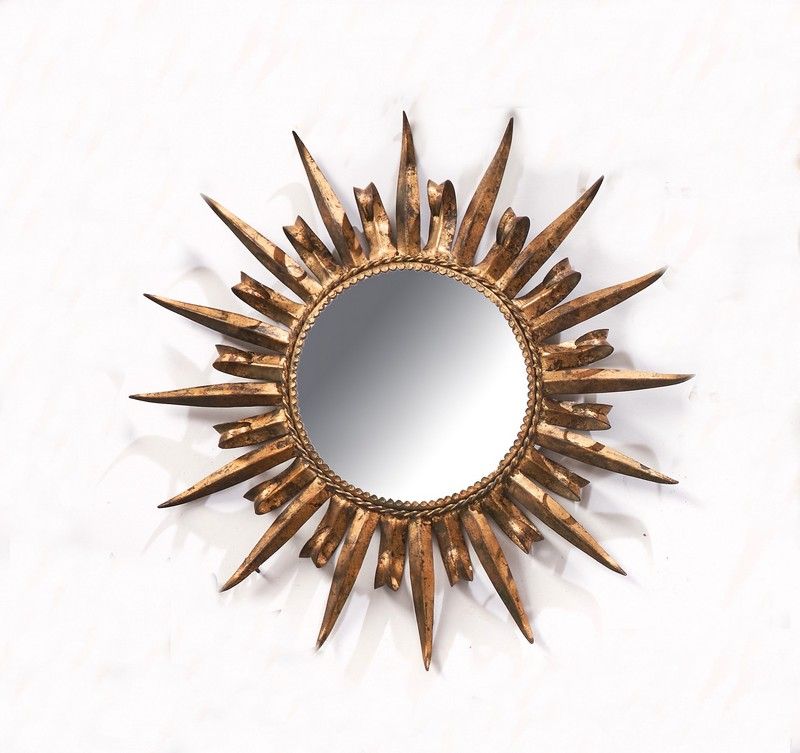 MIROIR SOLEIL rond dans un cadre en métal...