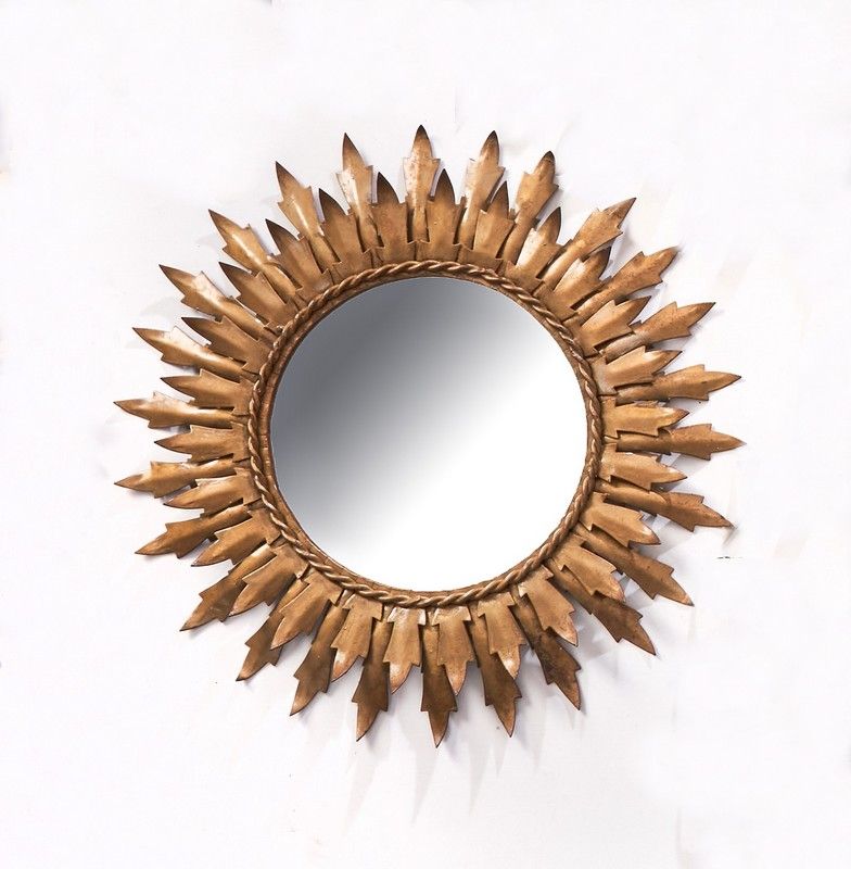 MIROIR SOLEIL rond dans un cadre en métal...